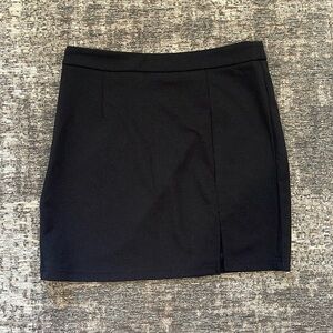 Black mini skirt with slight slit